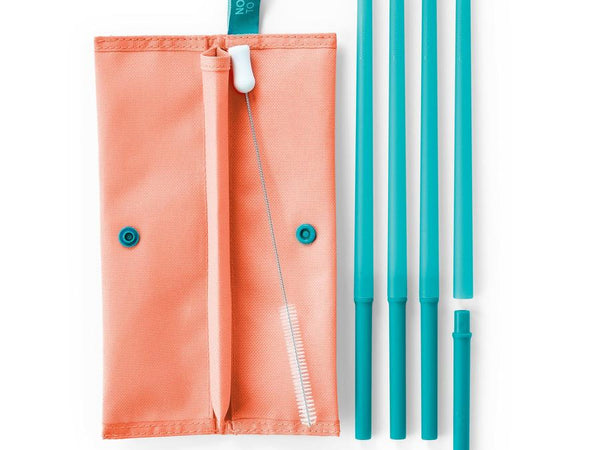 Four Blue green tupperware eco straw set laying on a white background with a pink case and pink bag