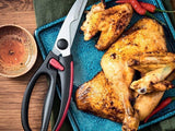 tupperware poultry shears folded next to a roasted chicken