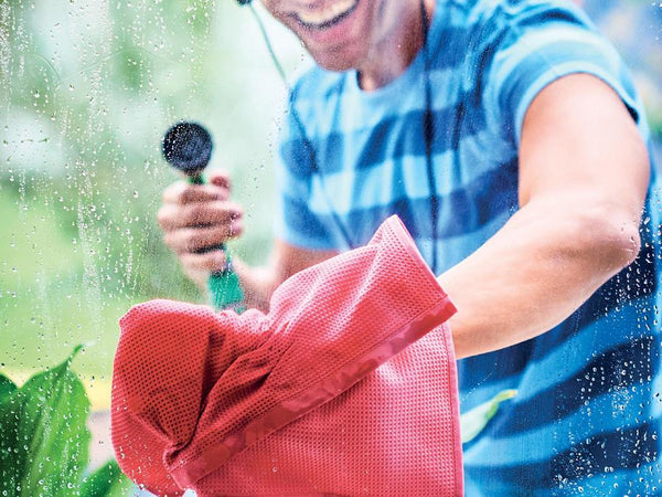 Tupperware Microfiber Window Towel wiping down a window