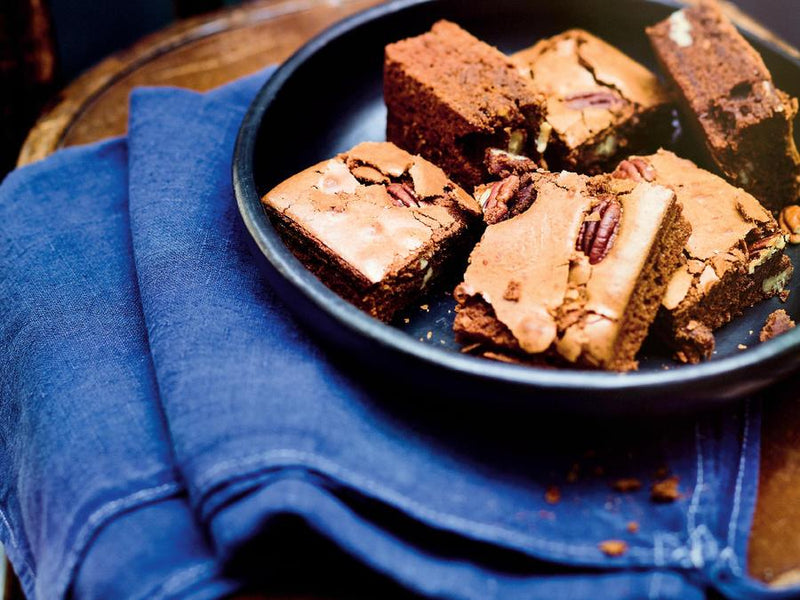 brownies sitting in a pan on top of jeans