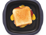 grilled cheese with toasted white bread in a tupperware micropro grill