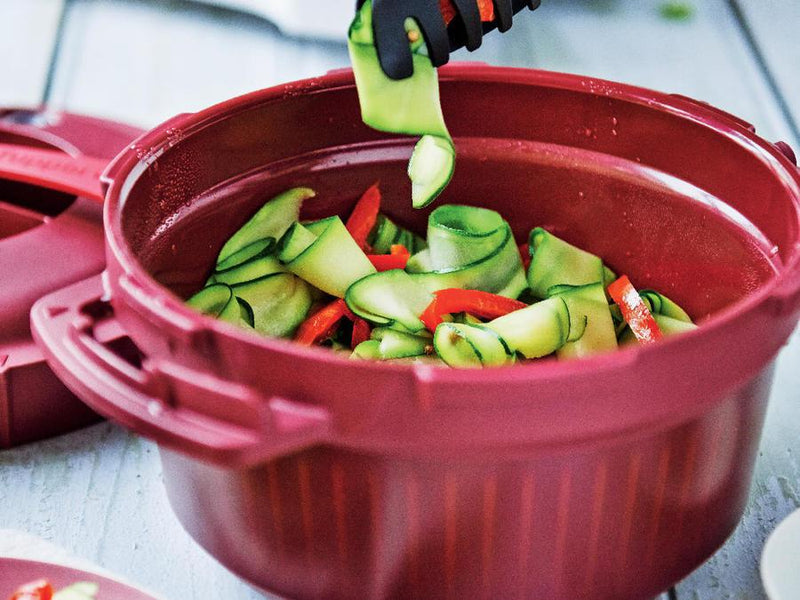 tupperware black tongs grabbing spiral veggies